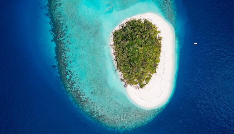 An aerial of an island in the Baa Atoll