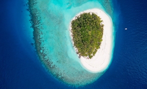 An aerial of an island in the Baa Atoll